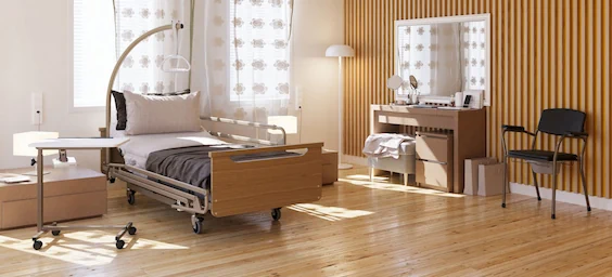 L'image représente une chambre confortable équipée d'un lit et d'un bureau. L'aménagement intérieur comprend un parquet ou un sol stratifié, des rideaux pour habiller les fenêtres et divers meubles, dont une commode et une chaise. Cet espace est conçu pour être à la fois fonctionnel et confortable, et convient parfaitement à un hôtel ou à une maison.